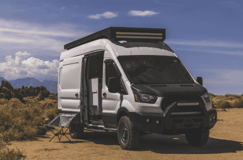 Upgraded camper van parked in a desert.