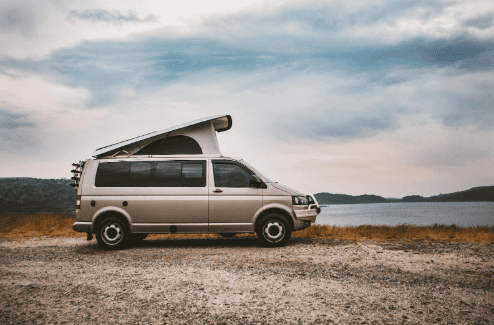 Travel van with pop-up bed on the vehicle roof.